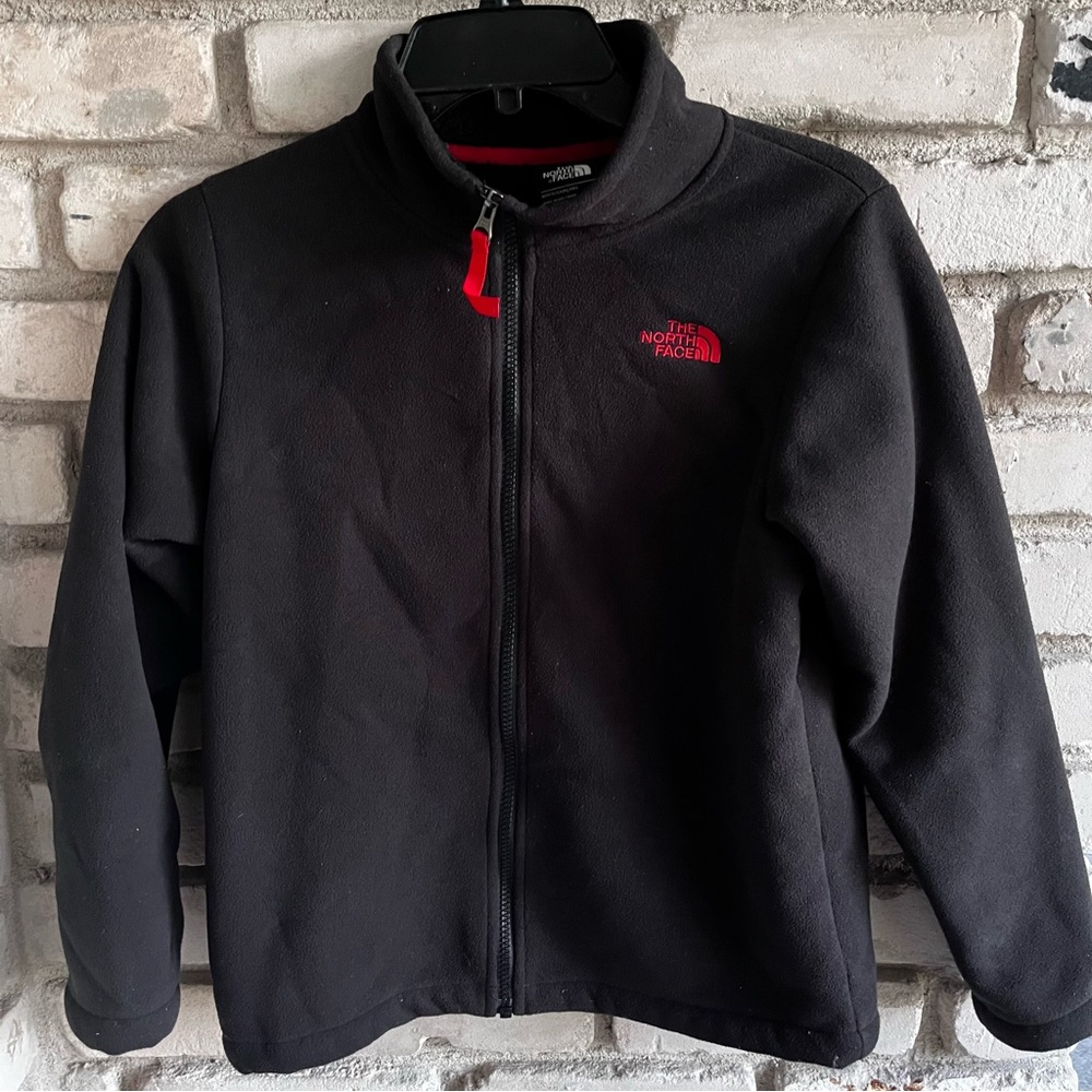 The North Face Black boys Jacket with Red Logo front full zipper.